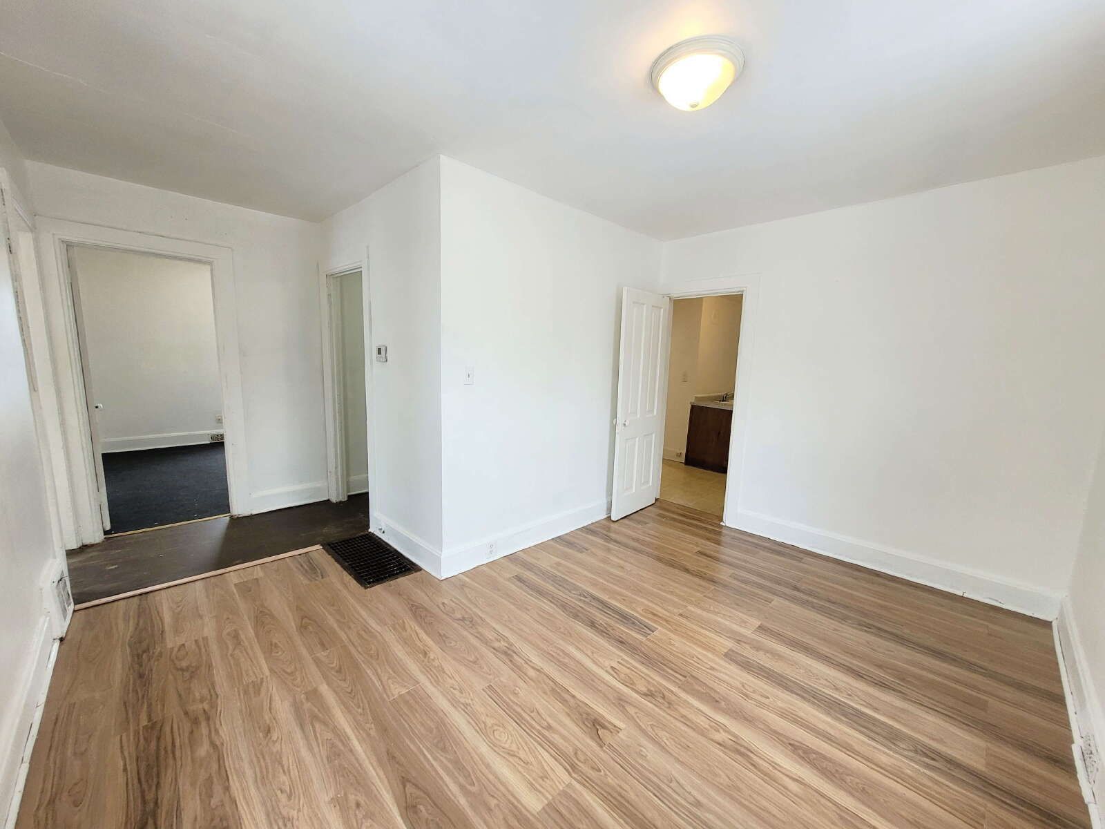 Bright 2BR Upper with LVP Flooring, Basement Storage & Off-Street Parking