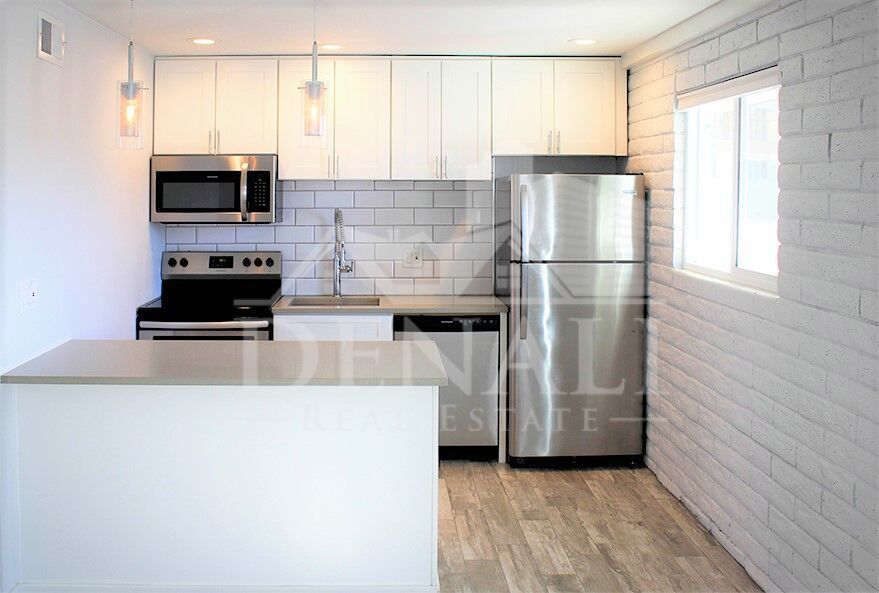 Apartment kitchen — representative home at Sir John’s Apartments.